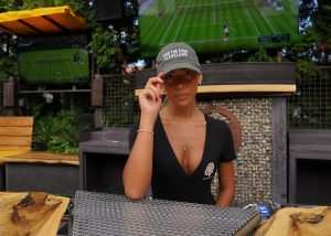 female with find the cash hat at a local restaurant