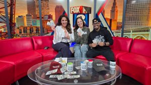 FOX 8 News feature showing Find the Cash Cleveland founder Khristian Santana during a live broadcast about Cleveland’s citywide cash drop challenge